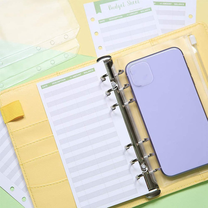 Budgetplaner mit Geldumschlag